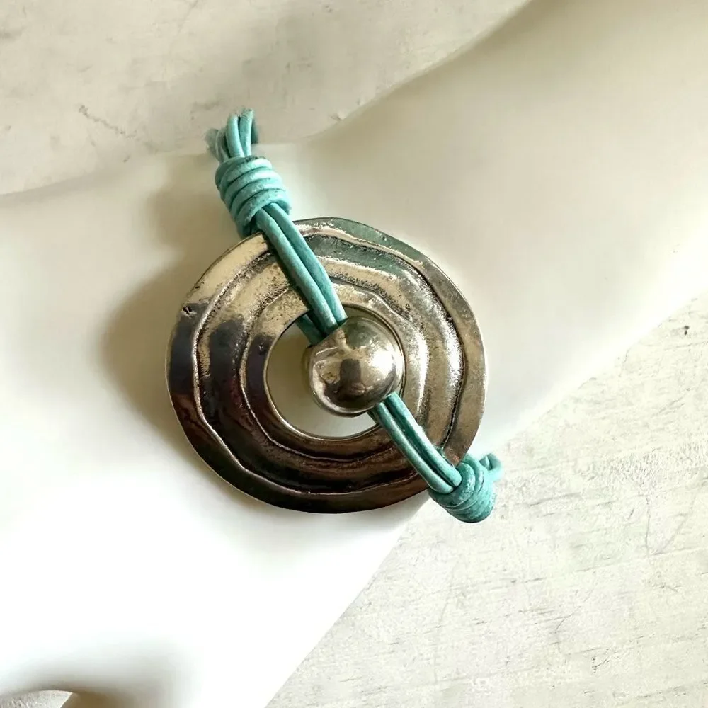 Silver tone blue cord bracelet